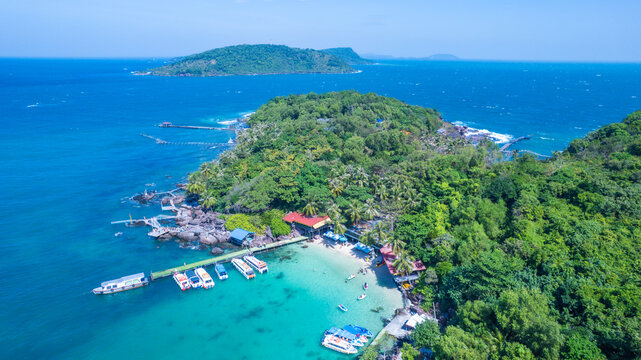 Aerial view of beautiful landscape, tourism boats, and people swimming on the sea and beach on May Rut and Mong Tay island in Phu Quoc, Kien Giang province, Vietnam