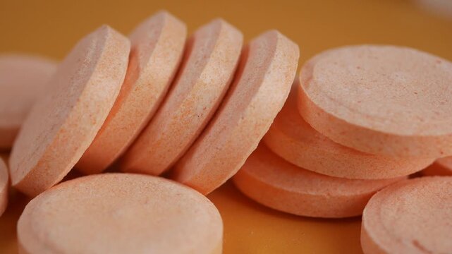 orange colored, disc shaped effervescent tablets