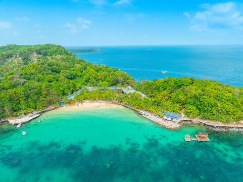 Aerial view of beautiful landscape, tourism boats, and people swimming on the sea and beach on May Rut and Mong Tay island in Phu Quoc, Kien Giang province, Vietnam