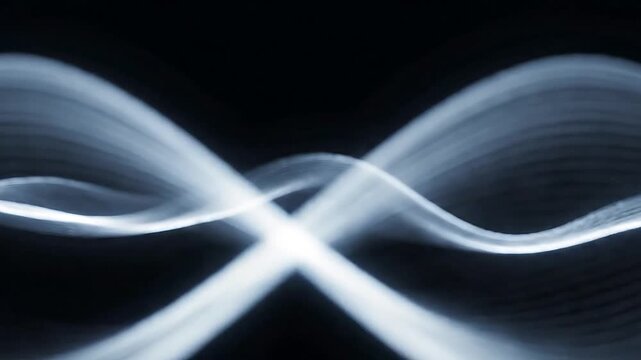 Abstract light waves creating a dynamic and ethereal atmosphere.