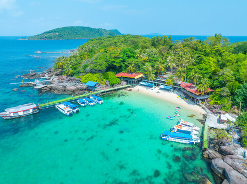 Aerial view of beautiful landscape, tourism boats, and people swimming on the sea and beach on May Rut and Mong Tay island in Phu Quoc, Kien Giang province, Vietnam