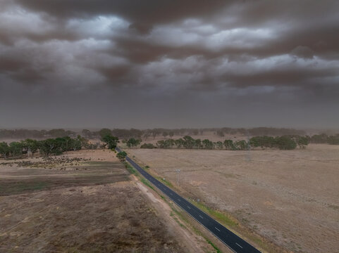 Aerial view of a summer dust storm approaching over dry farmland