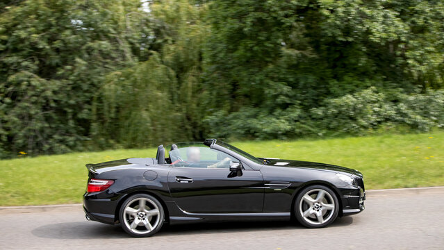 Milton Keynes,Bucks,UK - June 21st 2026: 2011 Mercedes Benz SLK 350 AMG Sport Edition car driving on a British road