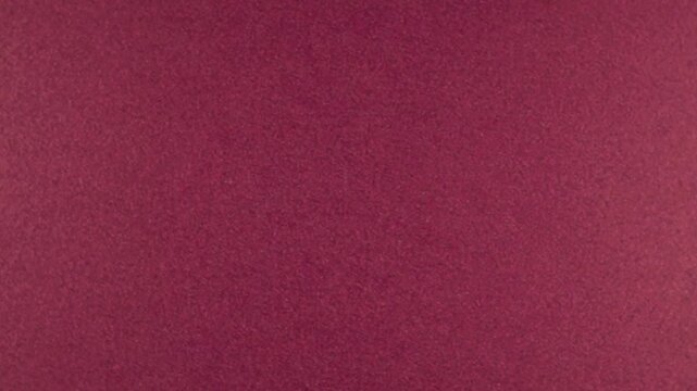Rotation of new burgundy sheet of paper