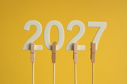 2027 New Year Number on Sticks with Yellow Background Minimal Concept
