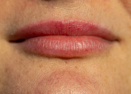 Close-up of natural lips with soft pink hue