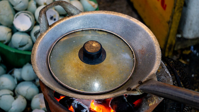Kerak telor is a dish from the Betawi (Jakarta, Indonesia), consisting of an omelet mixed with white glutinous rice, dried shrimp, and spices.