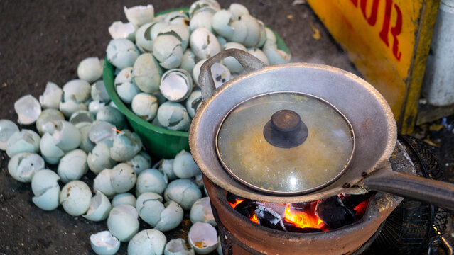 Kerak telor is a dish from the Betawi (Jakarta, Indonesia), consisting of an omelet mixed with white glutinous rice, dried shrimp, and spices.