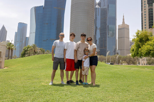 Happy european family, visiting Doha during the hot summer months