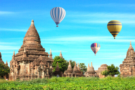 Balloon flight, famous tourist attraction of Bagan, Myanmar. Aerial view on air balloons and ancient stupas, Pagan, Burma. Topic of vacation, travel, trip abroad on vacation, cruises and tours