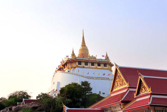 Stupa in Wat Saket Ratchawora Mahawihan Temple (Golden Mount), sightseeing landmark of Bangkok, Thailand. Buddhist temple on mountain in sunset light. Topic of vacation, travel, trip, cruises, tour