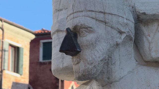 Weathered Stone Statue With Metal Cone Nose