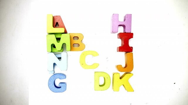The alphabet makes the letter N with color wooden letters stop motion 