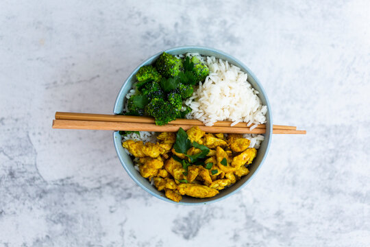 Rice with chicken curry and broccoli