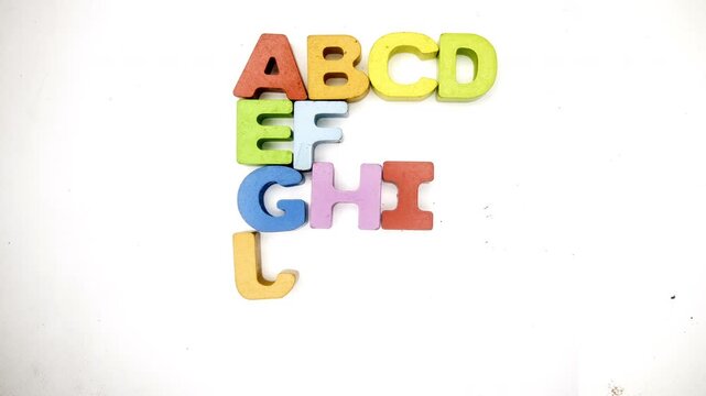 The Alphabet makes the letter F with color wooden letters stop motion 