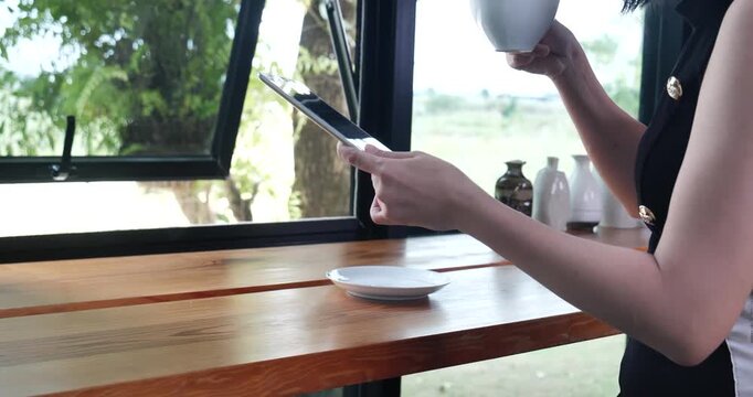 Close up Hands holding coffee cup. Couple lover drinking cup of coffee latte art together. Top view hands two people happy in cafe coffee shop. Espresso shot Young couple happy date relaxing in cafe