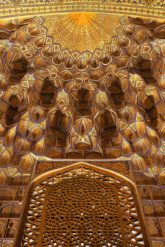 Gilded muqarnas ceiling inside Gur-e-Amir mausoleum in Samarkand showing intricate geometric patterns. Ideal for travel publications, architecture features, and cultural heritage materials.