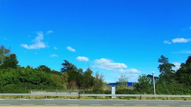 Car Drive on British Highways. Car Mounted Camera Time Lapse Footage of British Road Travel and Traffic During Blue Sky and Mostly Sunny Day Drive on British Motorways and Highways of England UK