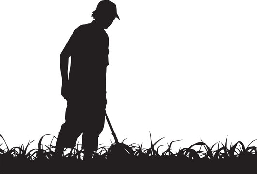 Silhouette of a man digging in grass with a shovel person