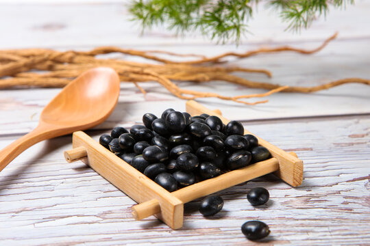 Black Soybeans in Wooden Scoop