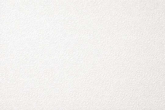 Elegant white floral paper texture with delicate embossed botanical pattern. Perfect for backgrounds, stationery, and soft minimalist or wedding-themed designs.