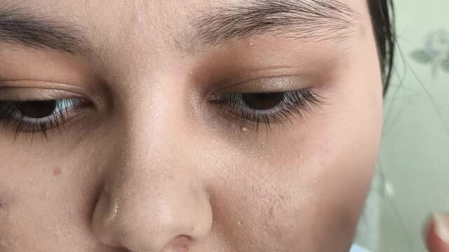 Woman rubbing tired eyes, eye strain and vision problems concept, fatigue, discomfort and healthcare topic.