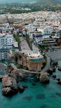 Vertical aerial panoramic view of Nerja picturesque town and one of the most famous viewpoints on the Costa del Sol &ndash; Balc&oacute;n de Europa
