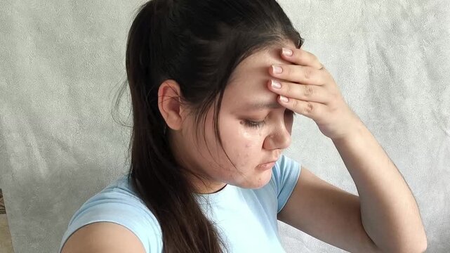 Sick woman with fever symptoms at home, checking body temperature, cold, flu and self care during illness.