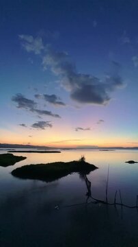 Timelapse of Serene Sunset Over Calm Water