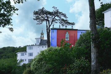 Fototapeta premium Colorful architecture of Portmeirion tourist village in Wales with charming houses and unique architectural details.