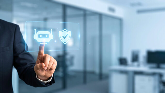 Businessperson's finger touching translucent panel with robot icon beside shield-and-checkmark icon in blue office, AI content moderation concept, intelligent content governance, AI safety agent