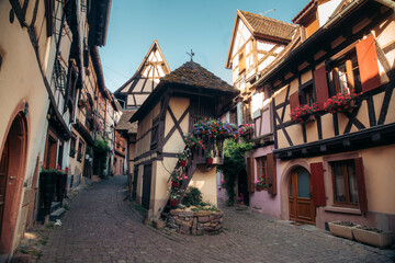 Fototapeta premium Charming old village of Eguisheim with blooming flowers in spring, Alsace region, France