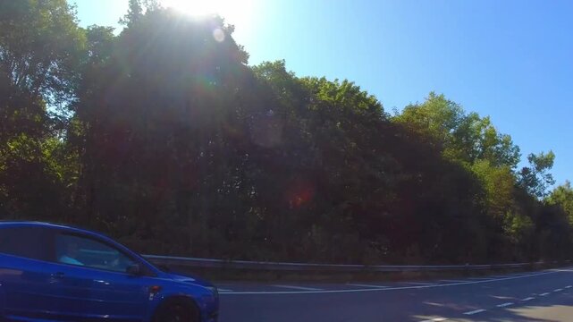 Car Drive on British Highways. Car Mounted Camera Time Lapse Footage of British Road Travel and Traffic During Blue Sky and Mostly Sunny Day Drive on British Motorways and Highways of England UK