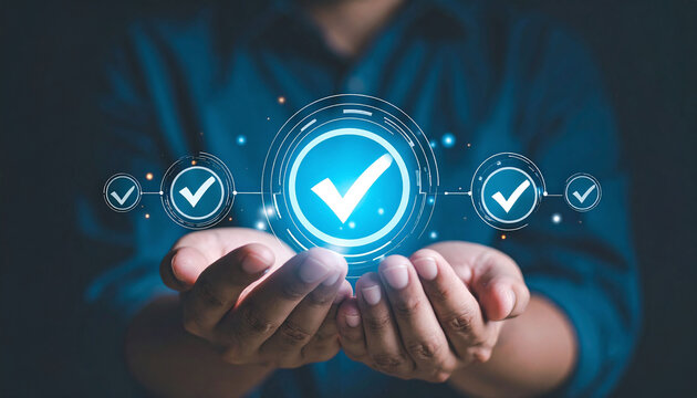 A business professional holds glowing digital checkmark icons in his hands, symbolizing quality assurance, trust, compliance, and successful standards in a modern corporate world.