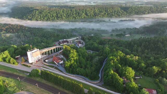 Sigulda Bobsleigh and Luge Track Above the Misty Gauja Valley at Sunrise, Latvia