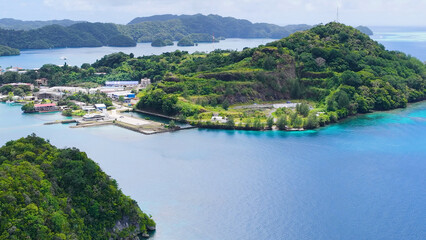 Aerial View of Coastal Town and Lush Islands in Palau © blueringmedia