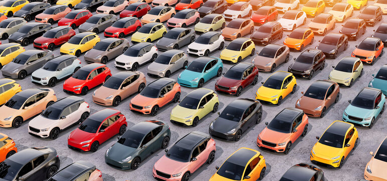 Large outdoor parking lot filled with modern electric cars automobile industry
