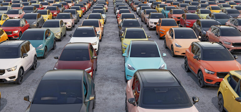 Large outdoor parking lot filled with modern electric cars automobile industry