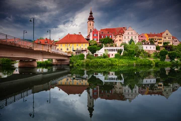 Frohnleiten, Styria, Austria. Cityscape image of picturesque town of Frohnleiten located in Styria, Austria with reflection of the city skyline in Mur River at stormy evening. © rudi1976