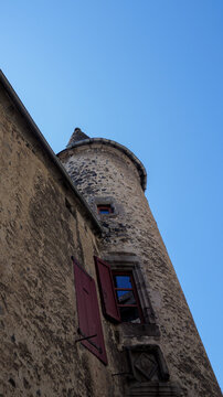 Historic French Tower Facade Against A Clear Blue Sky