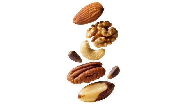 Assorted nuts and seeds falling almond walnut cashew pecan brazil nut, pine nut