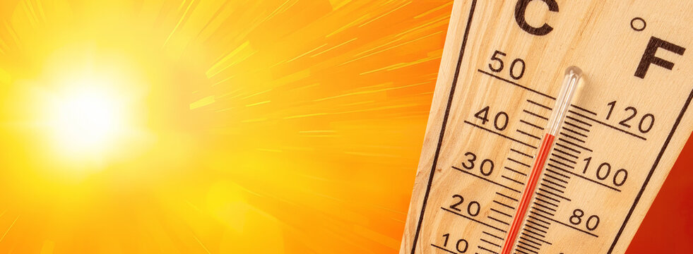 Thermometer showing extreme high temperature on a hot sunny day