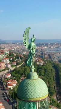 Trieste Victory Lighthouse overlooking the Adriatic Sea with rocky coast and peaceful Mediterranean seascape.