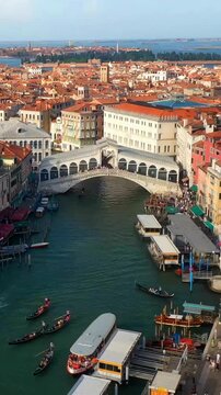Timelapse of Rialto Bridge in Venice showing dynamic canal activity and movement of boats and city life.