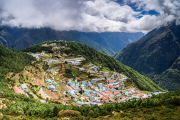Fototapeta premium Namche bazaar, a capital of Solukhumbu region and a place for rest and acclimatization on the Everest base camp trekking, from above. Sagarmatha national park, Nepal.