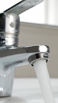 Ceramic sink with chrome fixture, close up