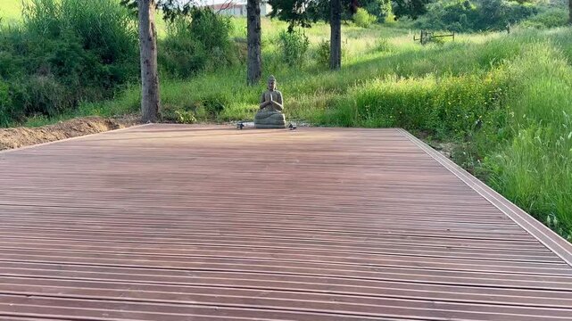 Wooden platform surrounded by a lush green meadow