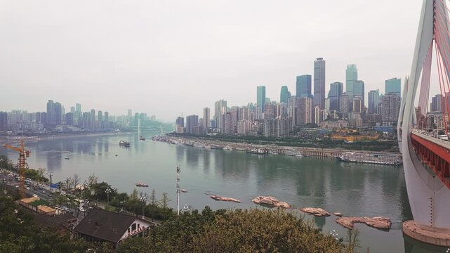 City Skyline From Long Men Hao Vantage Point Across The Yangtze River In Nan'an District, Chongqing, China. Pan Wide Shot