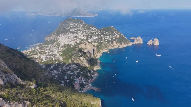 Aerial Drone Panoramic View of Entire Capri Island with Faraglioni Rocks, Town and Marina Grande, Bay of Naples Italy Summer