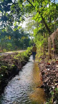 Young Woman Walking Barefoot Through Shallow Canal Mindfulness Nature Slow Motion